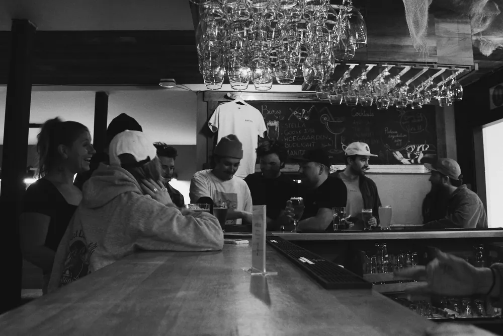 A full bar of guests and locals