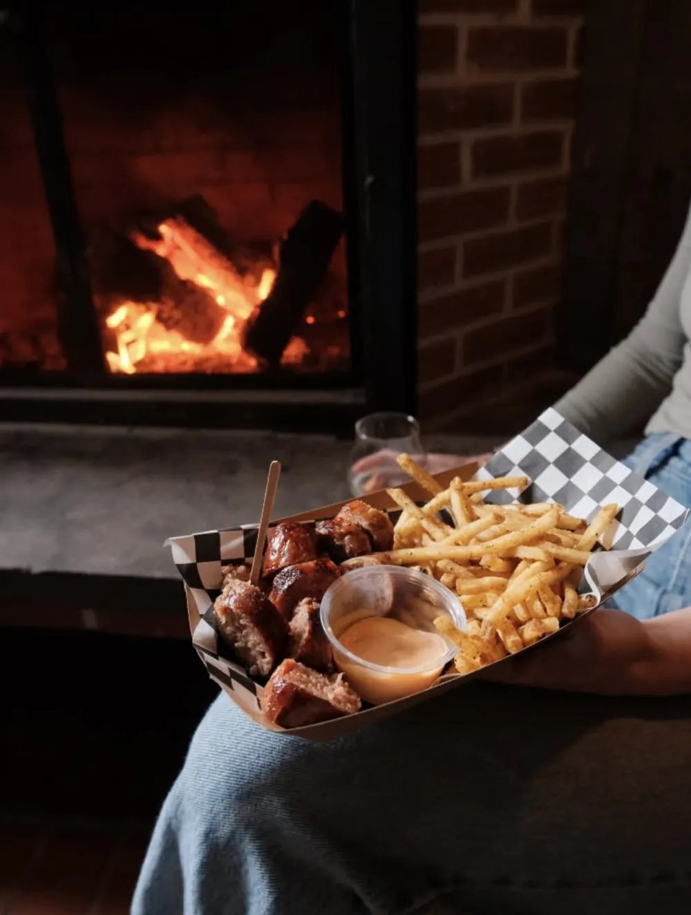 Sausage and fries by the fireplace