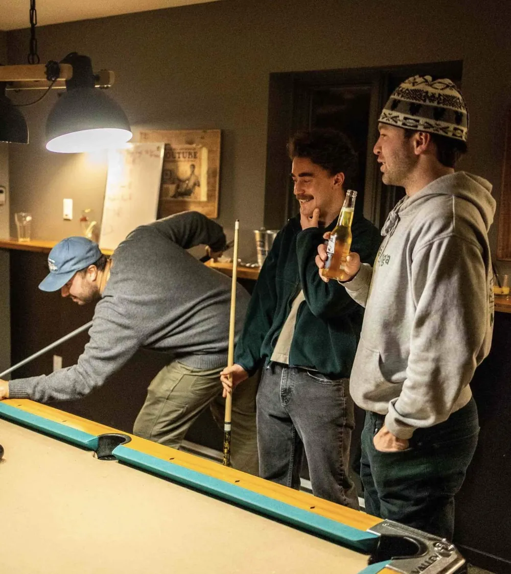 Friends playing pool at the bar