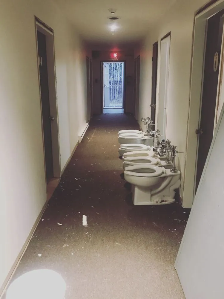 The hostel hallway in 2018, with old toilets pulled out during the renovation
