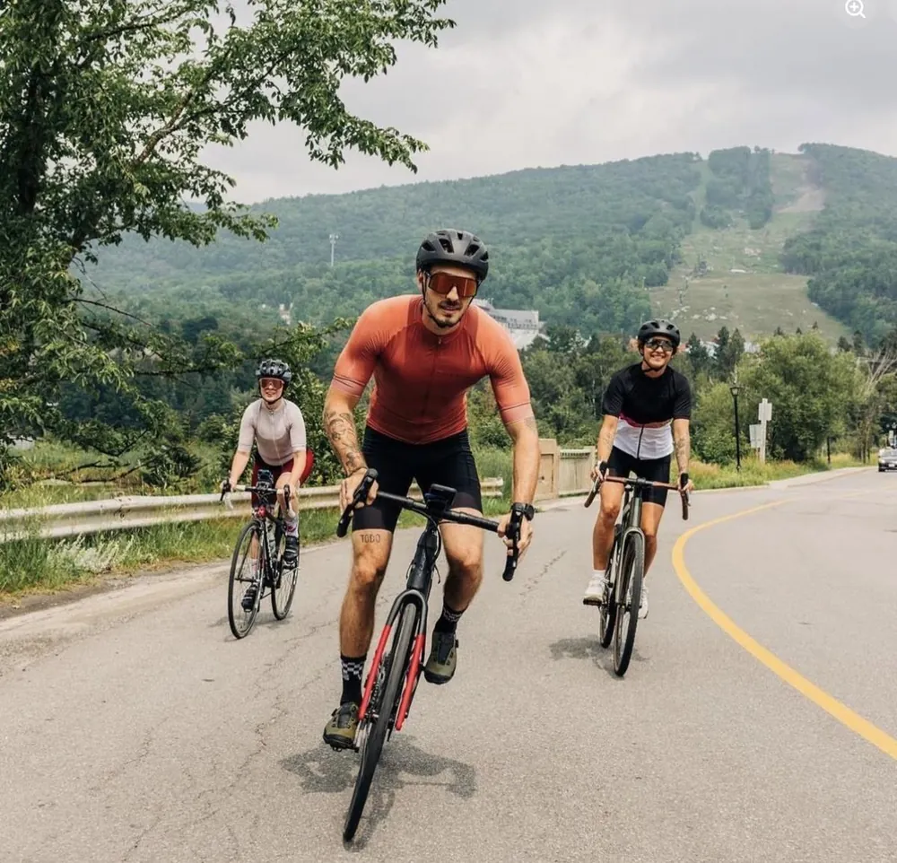 Road cyclists on Sentier le Réveil with Mont Tremblant behind