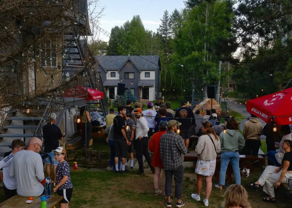 A big crowd gathered outside the Manitonga on a summer evening